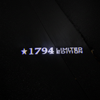 1794 Limited Edition Top-Down Puddle Light on Wet Asphalt