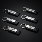 Carbon Fiber Chrome Keychains — Hero Flat Lay