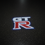 GT-R LED Puddle Light — Top Down Projection on Wet Asphalt