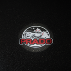 PRADO Red Top-Down Puddle Light on Wet Asphalt