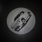 SUV Logo Top-Down Puddle Light on Wet Asphalt