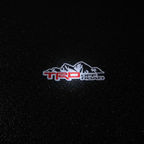 TRD Off Road Top-Down Puddle Light on Wet Asphalt